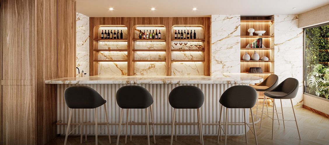 Salón bar del proyecto Aster Basadre en San Isidro de inmobiliaria Aster Homes con barra en mármol e iluminación cálida.